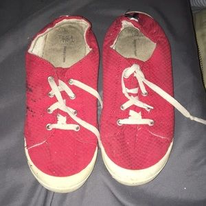 Worn red and white shoes size 10 memory foam has black paint on them
